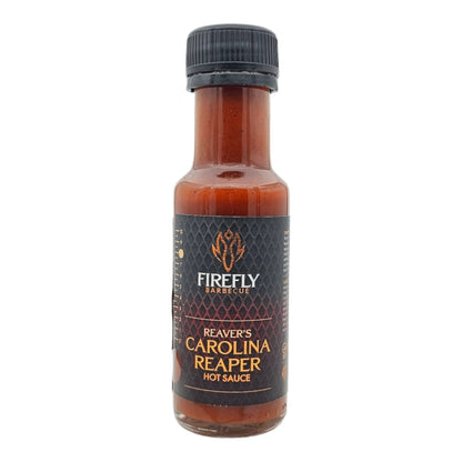 FireFly Barbecue Carolina Reaper hot chili sauce bottle with bright label and fiery red sauce inside.
