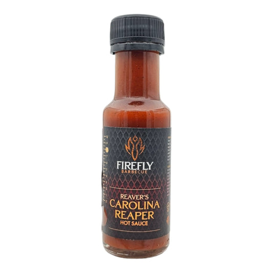 FireFly Barbecue Carolina Reaper hot chili sauce bottle with bright label and fiery red sauce inside.