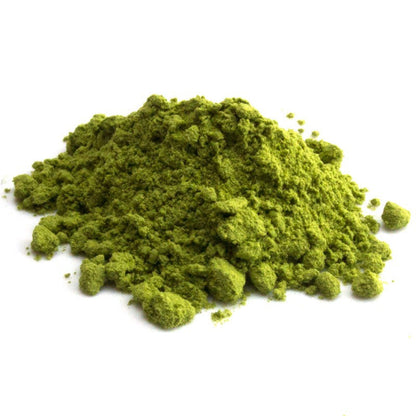 Ceremonial grade Japanese Matcha tea powder from PekoeTea Edinburgh, vibrant green matcha in a traditional bowl.
