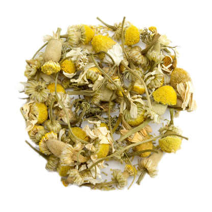 Fresh dried chamomile flowers for tea from PekoeTea Edinburgh, showing delicate yellow blossoms and green stems.