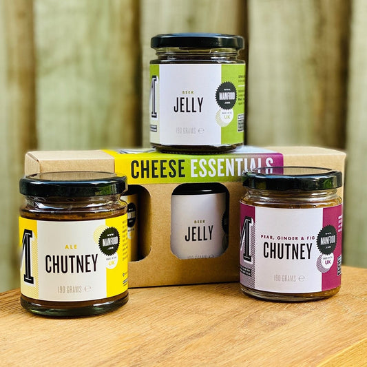 Manfood Cheese Essentials gift box with assorted chutneys and jellies, featuring colorful jars and elegant packaging.
