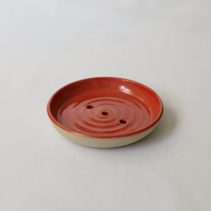 Cherry red ceramic soap dish by Katie L Thompson Designs, featuring a classic, curved design for bathroom or kitchen use.