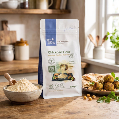 Organic chickpea flour from Whole Food Earth displayed in a kitchen setting with bowls and cooking ingredients.