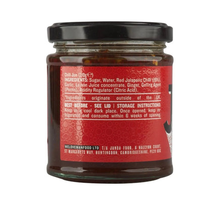 Jar of Janda Chilli Jam with vibrant red chili peppers and a glossy, spicy-looking texture in a clear glass container.