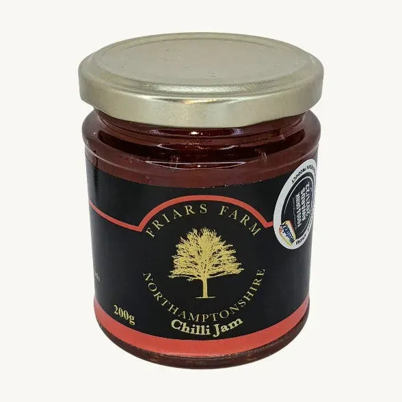 Jar of Friars Farm Chilli Jam with red chili peppers and jam spread, 200g jar on a white background