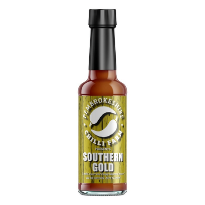 Southern Gold Chilli Sauce by Pembrokeshire Chilli Farm, vibrant orange chili sauce in a glass bottle with label.