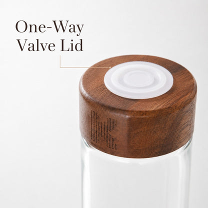 Set of walnut coffee bean display tubes with exhaust valve lids, featuring clear glass containers and wooden caps for fresh storage.