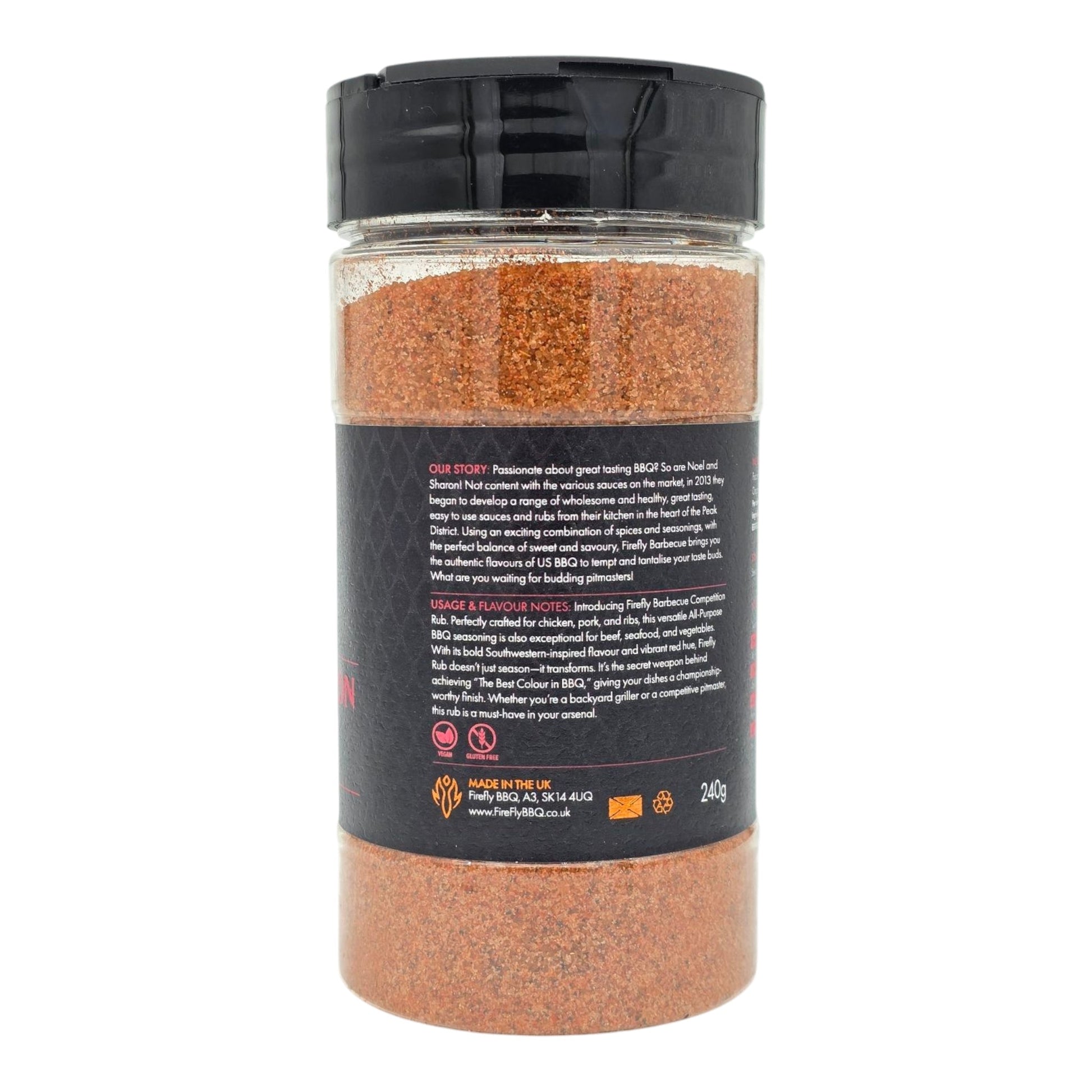 FireFly Barbecue Competition BBQ Rub jar showing the label and seasoning inside on a wooden surface.