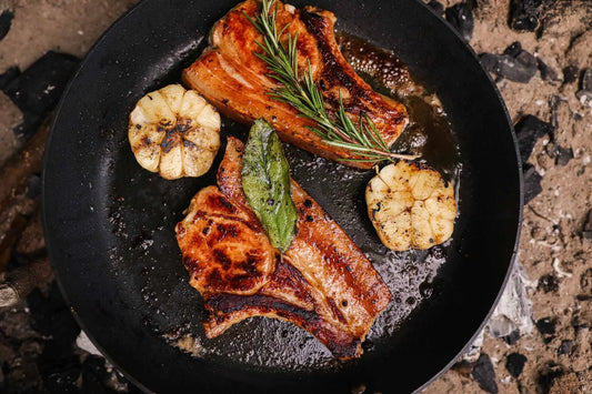 Cooked pork chops from Primrose Herd Half Pig Pork Box, showcasing tender, flavorful meat slices ready to serve.