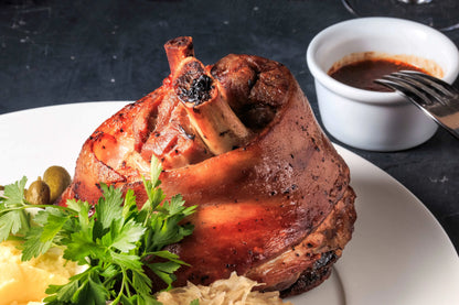 Cooked ham hocks from Primrose Herd, showcasing tender, flavorful ham hocks ready for serving or use in recipes.