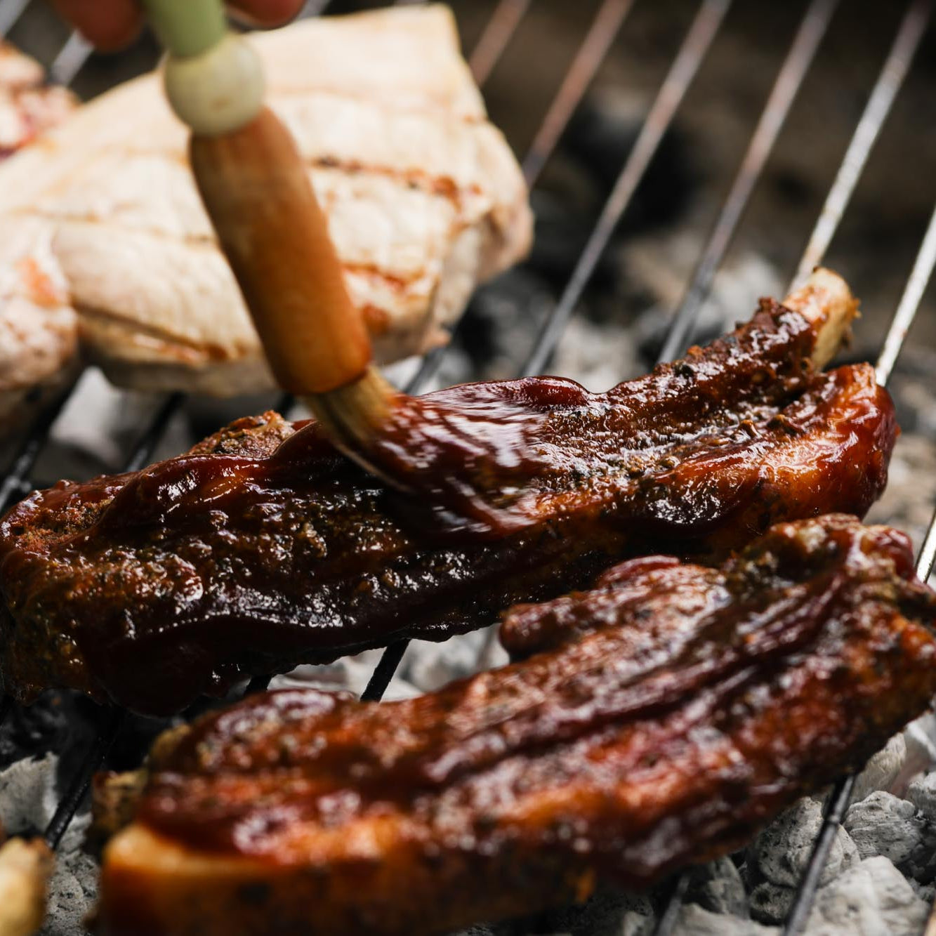 Cooked pork ribs from Primrose Herd, 500g, featuring tender, glazed pork ribs ready to serve.