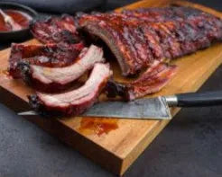 Cooked St Louis Style Pork Ribs from Primrose Herd, glazed and tender, ready to serve with a flavorful, smoky appearance.