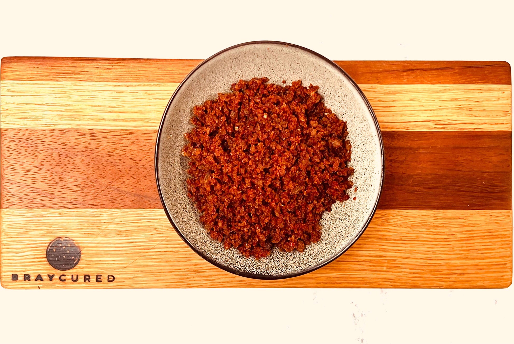 Bray Cured Meateors charcuterie in a bowl, showcasing cooked meat morsels with a rich, savory appearance.