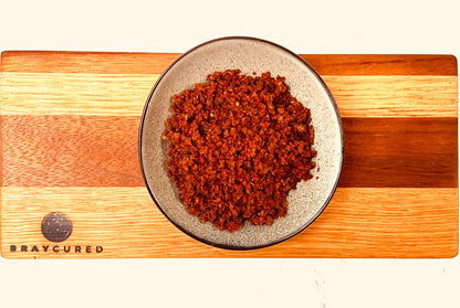 Bray Cured Meateors charcuterie in a bowl, showcasing cooked meat morsels with a rich, savory appearance.