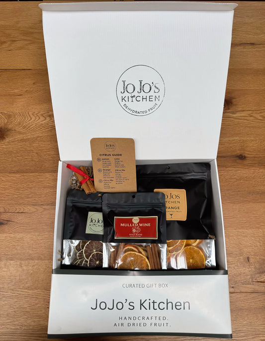JoJo’s Kitchen gift box with assorted treats, featuring neatly arranged items in a decorative box for special occasions.