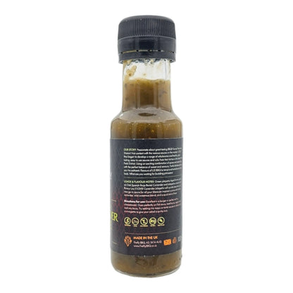 FireFly Barbecue Jalapeno Coriander & Lime hot sauce bottle with fresh lime and coriander in the background.