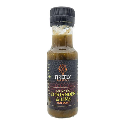 FireFly Barbecue Jalapeno Coriander & Lime hot sauce bottle, vibrant green and orange label with fresh ingredients.