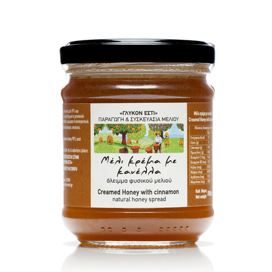 Creamed raw Greek honey with organic cinnamon in a jar, showcasing smooth texture and cinnamon swirl from The Greek Deli Club.