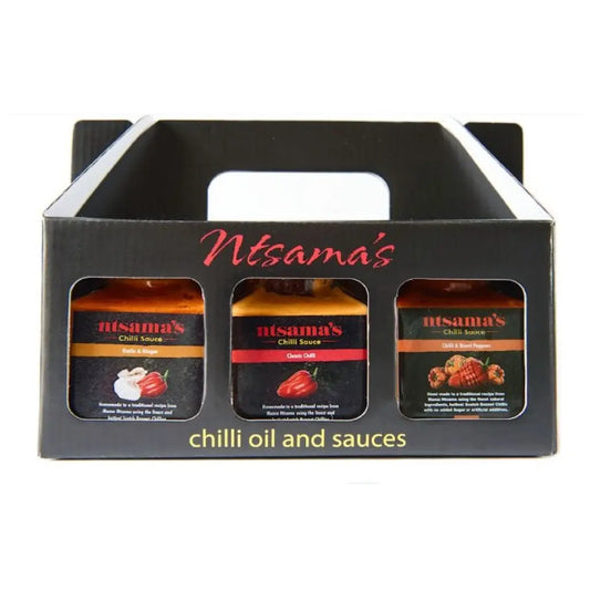 Assorted chili sauce gift set with multiple bottles featuring vibrant labels, perfect for spicy food lovers.