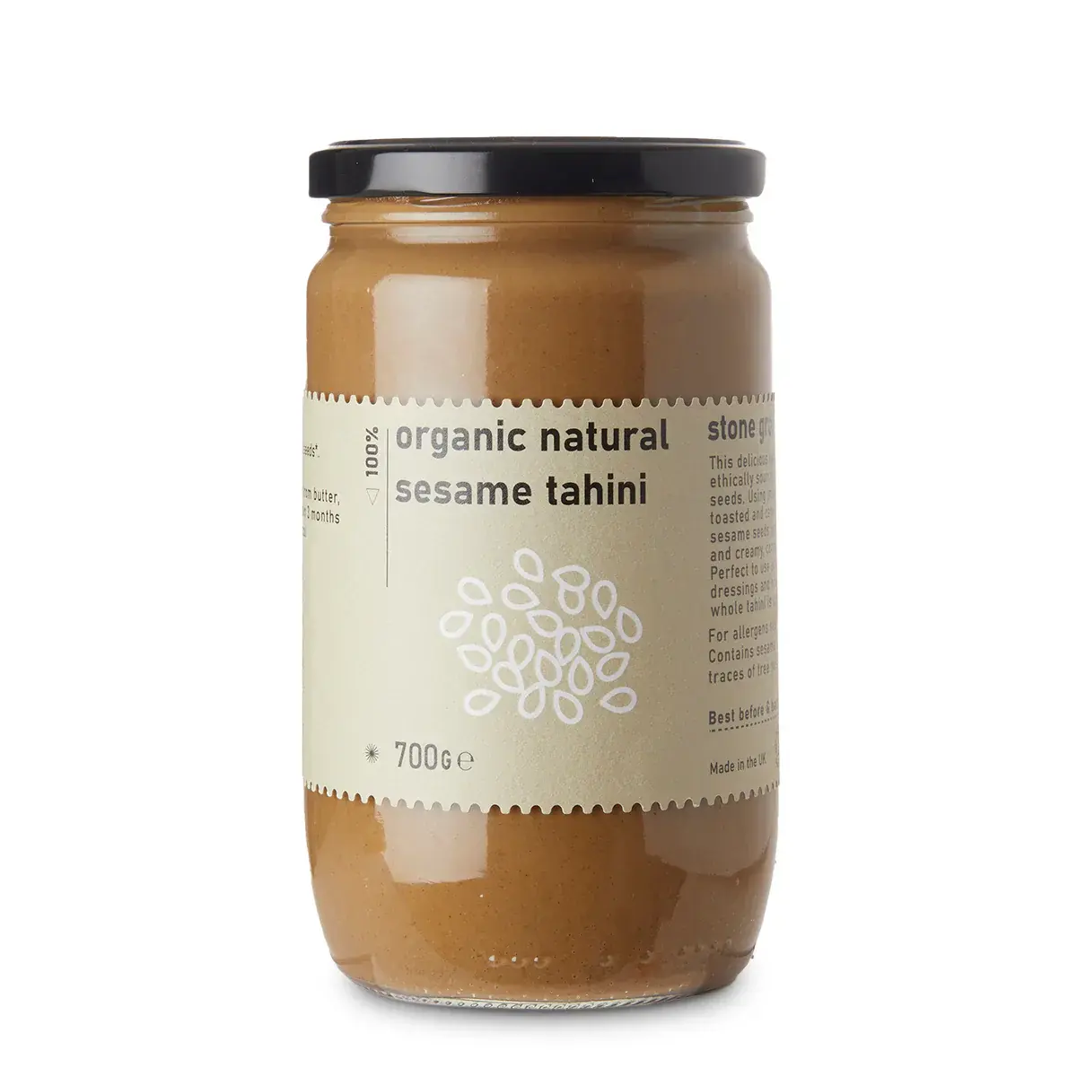 Organic Natural Sesame Tahini dip by Whole Food Earth, showing a creamy, beige sesame spread in a jar with a spoon.