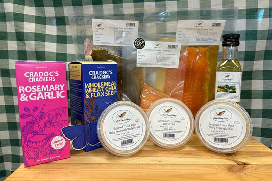 Smoked trout from Butler Country Estates in a Dairy-Free Christmas Bundle, ready for online order, displayed with fresh fish and festive packaging.