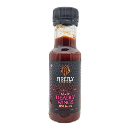 FireFly Barbecue 7 Deadly Wings Hot Sauce bottle with label featuring fiery design and product name on a white background.