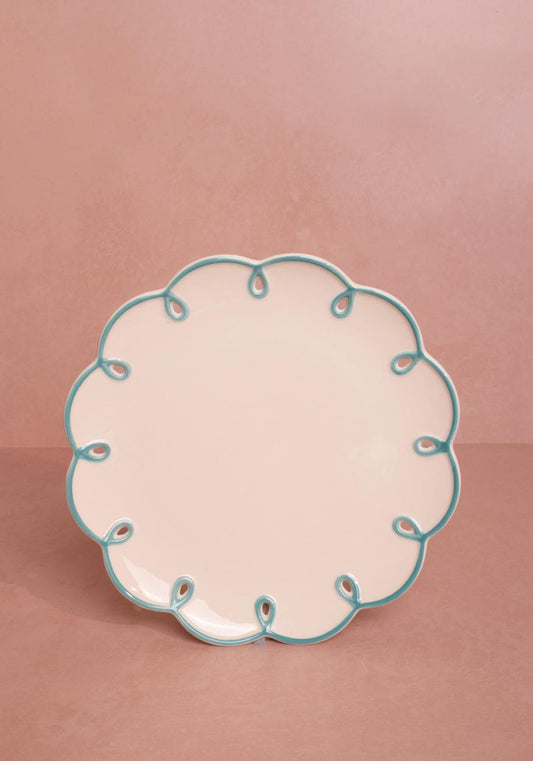 Set of four sky blue scalloped dessert plates by Casa by Josephine Jenno, featuring elegant, decorative edges for serving treats.