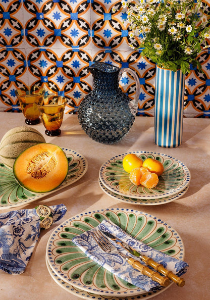 Set of four green Casa by Josephine Jenno Peacock dinner plates featuring colorful peacock feather designs.