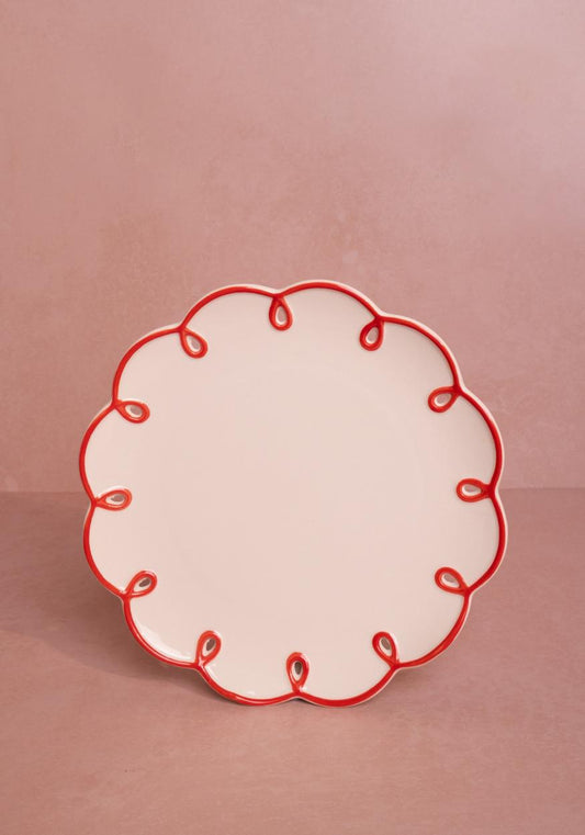 Set of four rosy red scalloped dinner plates by Casa, featuring elegant, wavy edges perfect for lunch or dinner settings.