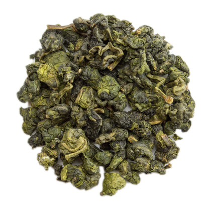 Fujian Dong Ding Oolong Tea leaves in a traditional tea setting, showcasing the PekoeTea Edinburgh brand.
