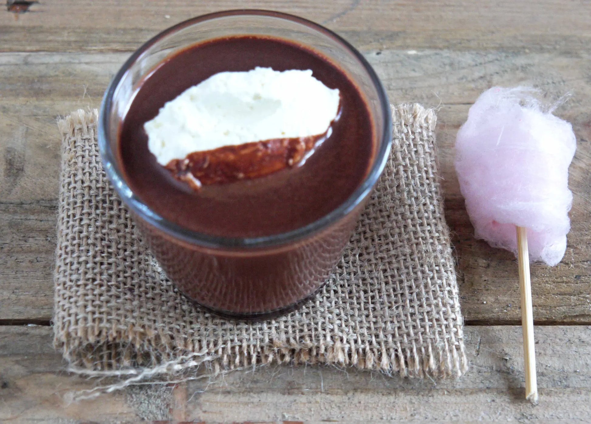 Gorvett & Stone Chilli Drinking Chocolate topped with colorful candy floss in a glass mug.