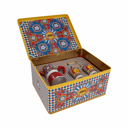 Bialetti X Dolce&Gabbana Sicilian Cart gift set with two espresso cups, gold stirrers, and a Moka 2-cup coffee maker.