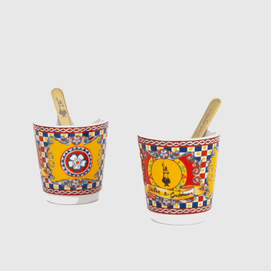 Bialetti hardware Sicilian Cart gift set with two espresso cups, gold stirrers, and packaging featuring Dolce&Gabbana branding.