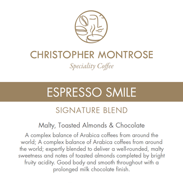 Christopher Montrose Coffee Arabica Espresso Smile coffee beans in a labeled bag, showcasing the colorful design and branding.