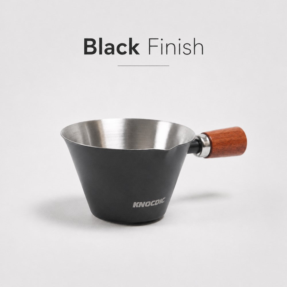 Black KNOCDIC® 100ml espresso measuring cup with clear markings for precise coffee brewing.
