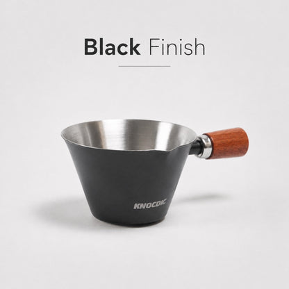 Black KNOCDIC® 100ml espresso measuring cup with clear markings for precise coffee brewing.