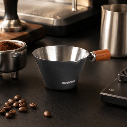 KNOCDIC® 100ml espresso measuring cup with a sleek design, ideal for precise coffee brewing and measuring small quantities.