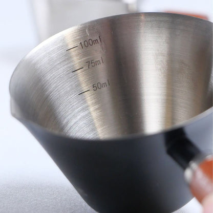 KNOCDIC® Espresso measuring cup with 100ml capacity, clear markings, and a sturdy handle for precise coffee measurements.