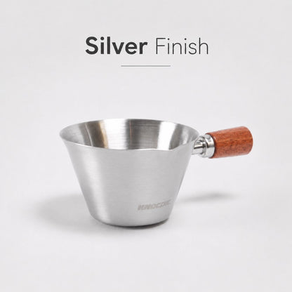 Silver KNOCDIC® espresso measuring cup with 100ml capacity, featuring clear measurement markings and a sleek design.