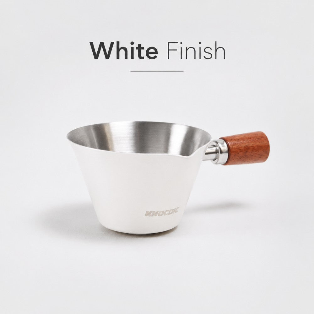 White KNOCDIC® espresso measuring cup with 100ml capacity, featuring clear measurement markings for precise coffee brewing.