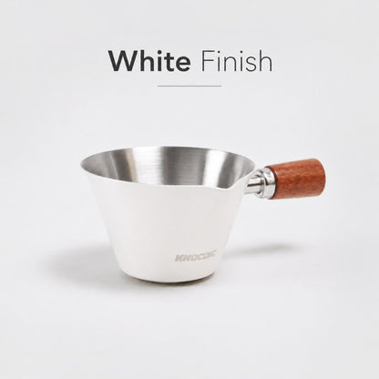 White KNOCDIC® espresso measuring cup with 100ml capacity, featuring clear measurement markings for precise coffee brewing.