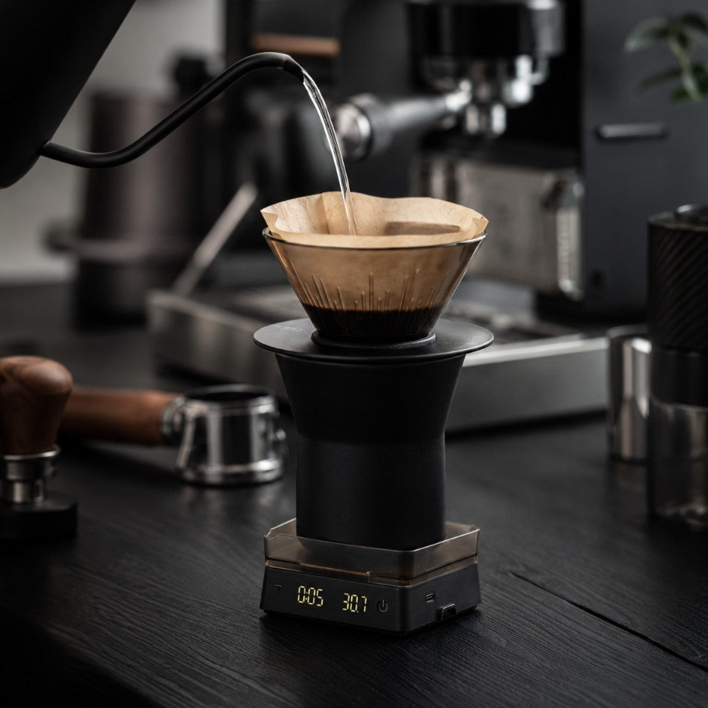 KNOCDIC® Mini Coffee Scale with Timer measuring espresso for precise brewing, with a digital display and stainless steel surface.