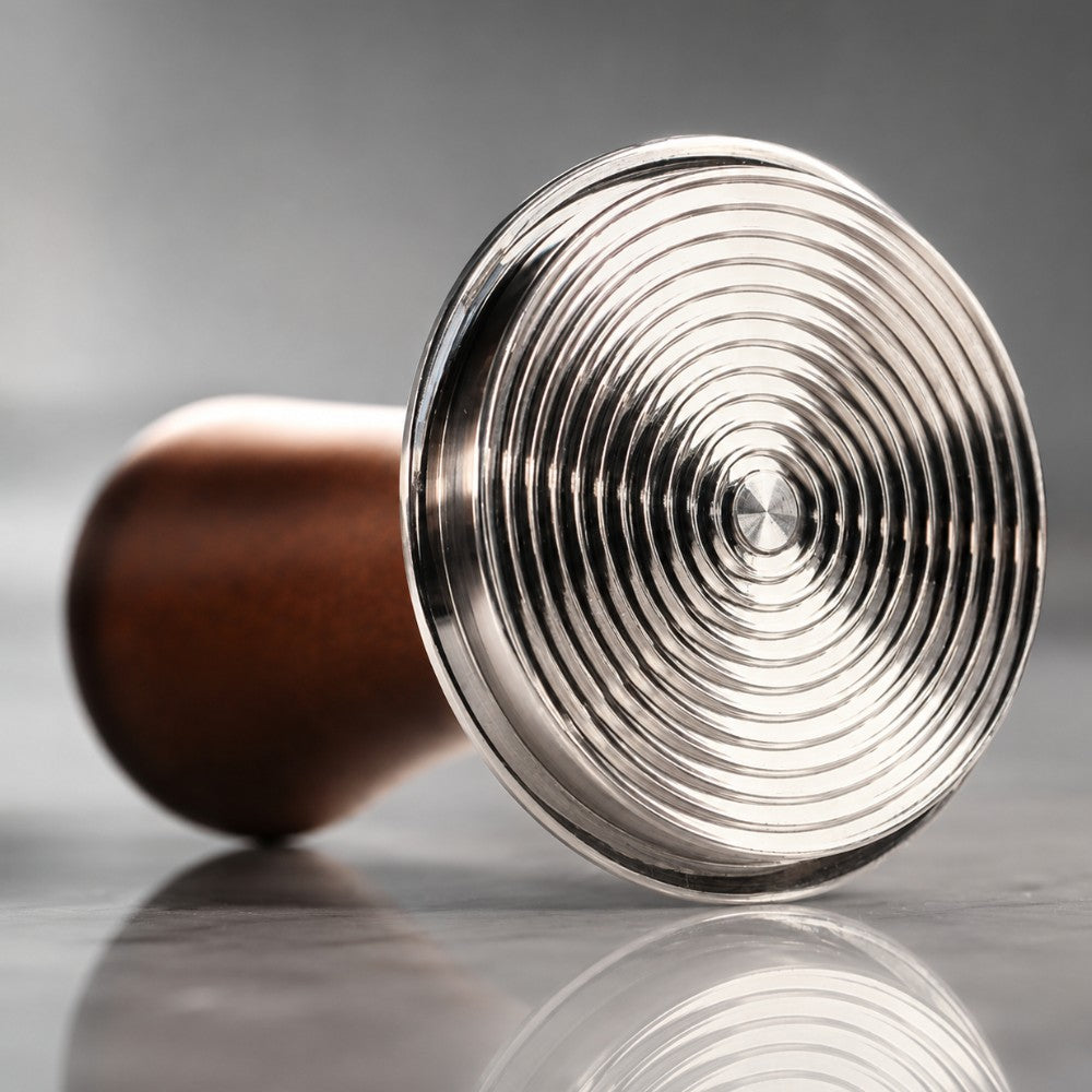KNOCDIC® espresso tamper with spring-loaded base for professional coffee tamping, shown in a stylish barista setting.