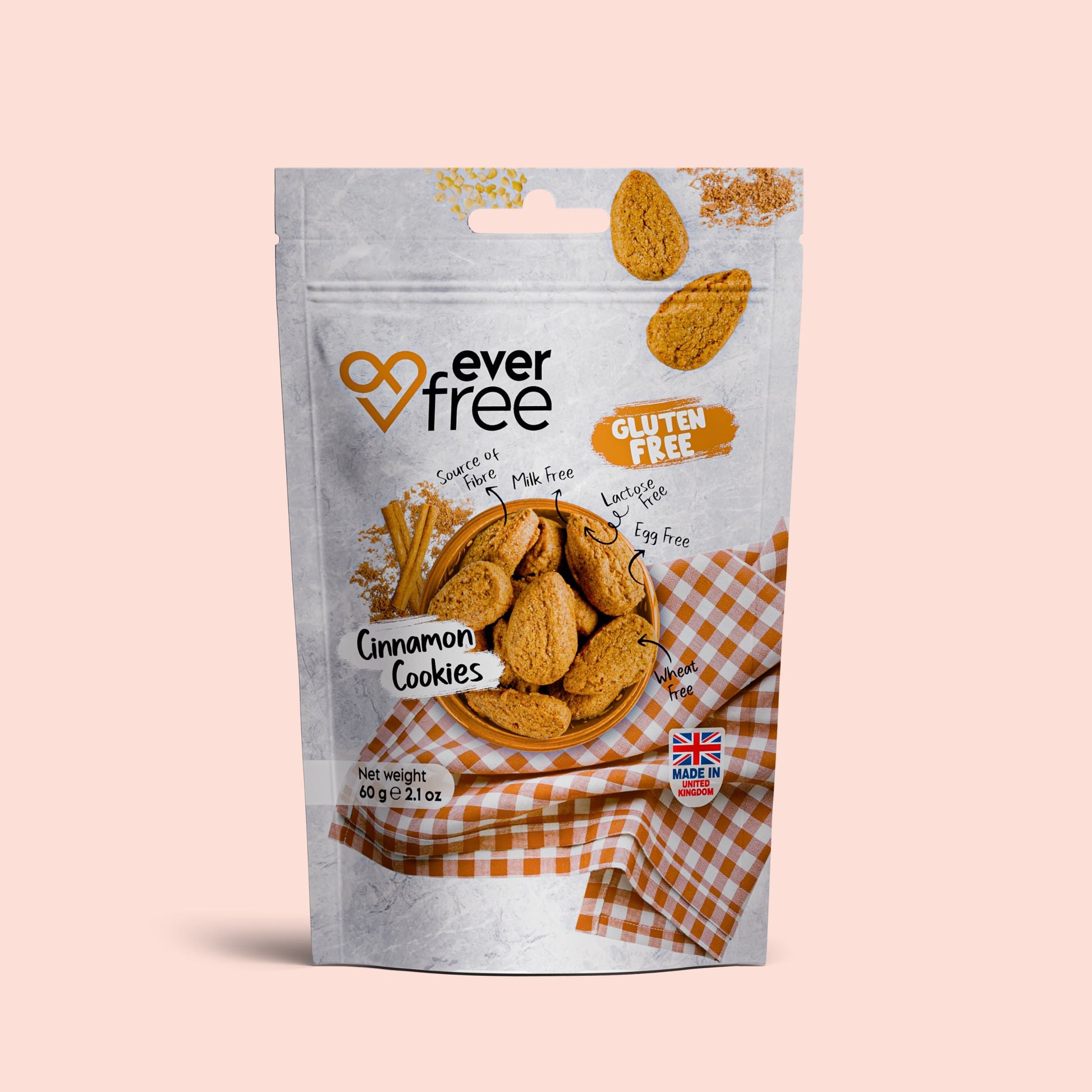 Three packs of EverFree gluten-free cinnamon cookies with hazelnut flavor, each 60g, displayed in a row.