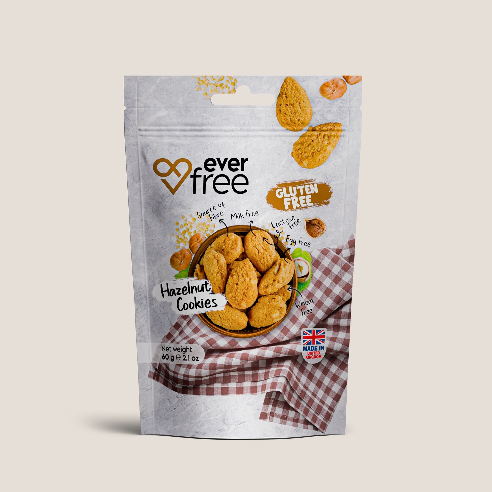 Pack of three EverFree gluten-free hazelnut cookies, 60g each, showing golden-brown, nut-filled cookies on a white background.