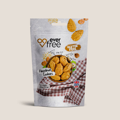 Pack of three EverFree gluten-free hazelnut cookies, 60g each, showing golden-brown, nut-filled cookies on a white background.
