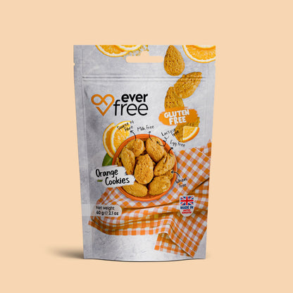 Three packs of EverFree gluten-free orange cookies, 60g each, with bright packaging and orange-flavored cookies visible.