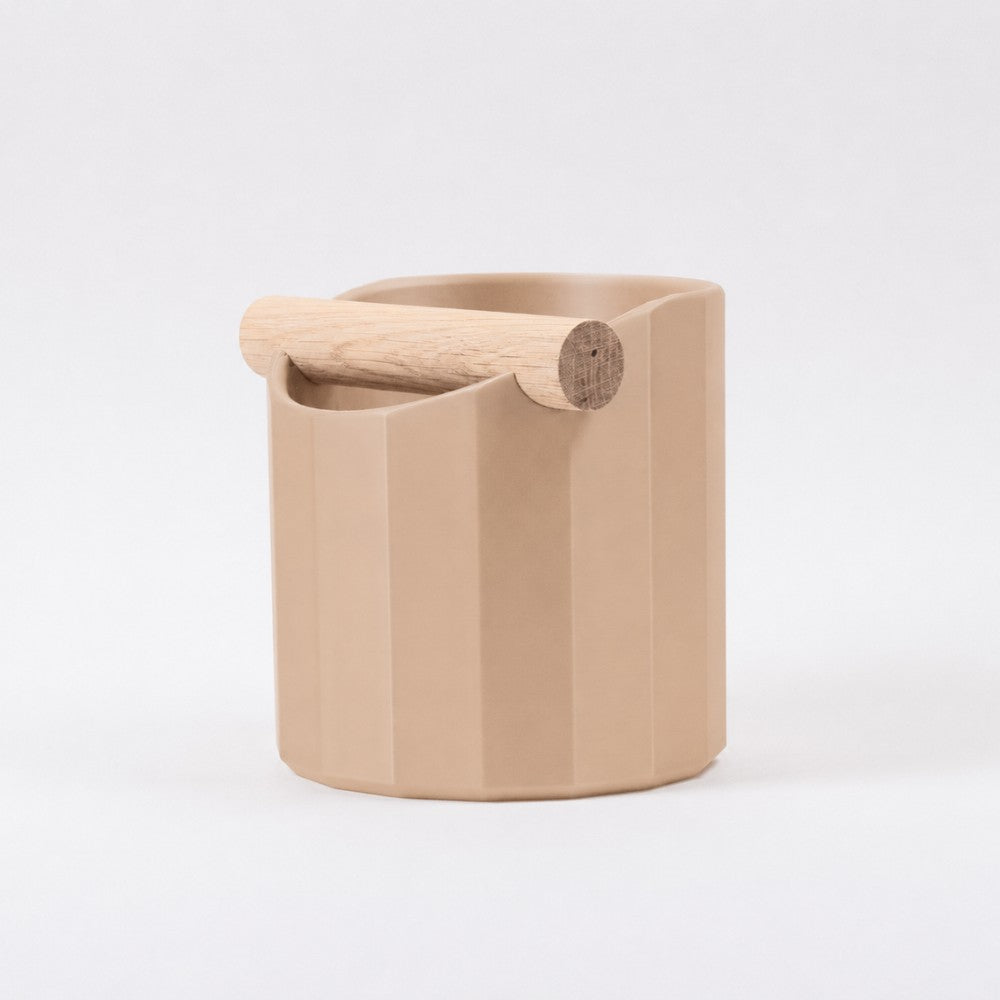 KNOCDIC® Facet Geometric Espresso Knock Box with latte brown finish and oak knock bar for barista coffee prep.