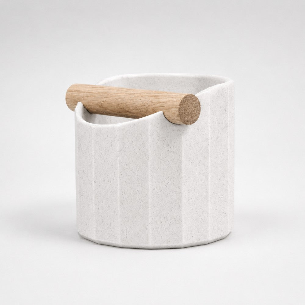 White marble Facet Geometric Espresso Knock Box by KNOCDIC® with oak knock bar for espresso shot preparation.