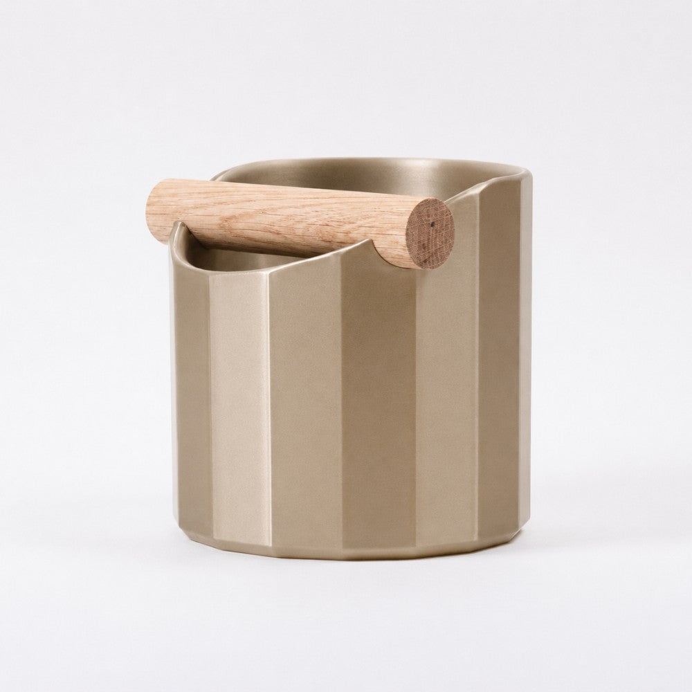 KNOCDIC Facet Geometric Espresso Knock Box with metallic gold finish and oak knock bar for coffee machine maintenance.